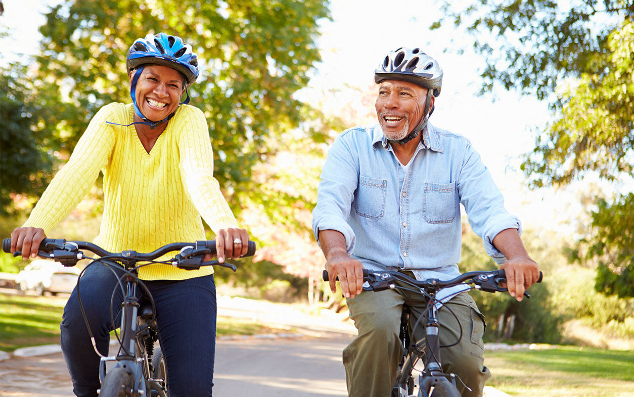 Couple exercising on bikes