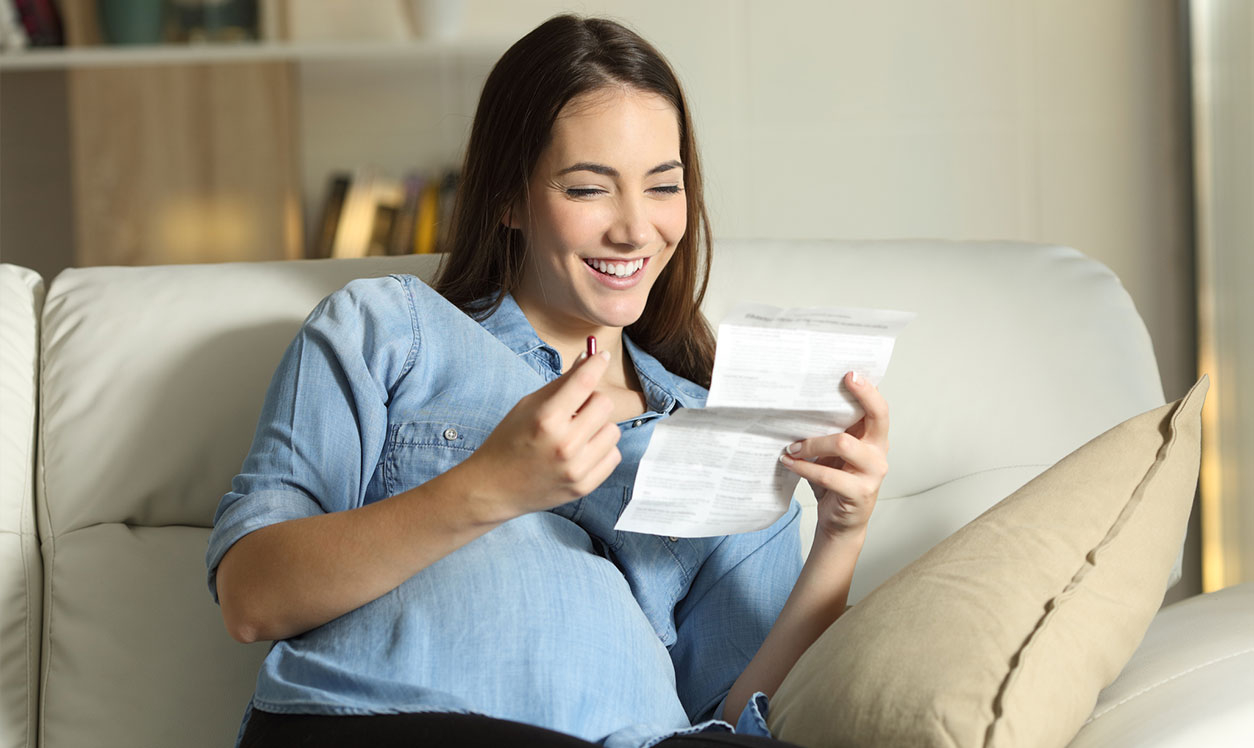 pregnant lady reading medication leaflet